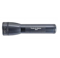ML25LT LED 2-Cell C flashlight in gray with Timothy M. Gallops 2024 engraving along the body