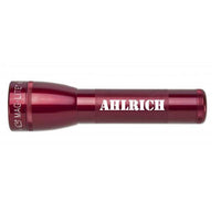 Red MagLite style ML25LT two-cell C flashlight with custom engraving along the body