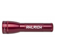 Red ML25LT LED 2-Cell C flashlight with custom engraving along the body