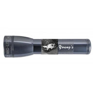 Gray ML25LT LED 2-cell C flashlight with custom engraving featuring a black and white car photo and Young's script.