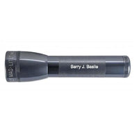 Gray ML25LT LED two-cell C flashlight with textured grip and Barry J. Basile engraved