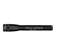Black Mini Maglite Pro LED flashlight with custom engraving Carter Orchards along the barrel