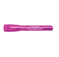 Pink Mini Maglite Pro LED flashlight with custom engraving along the body.