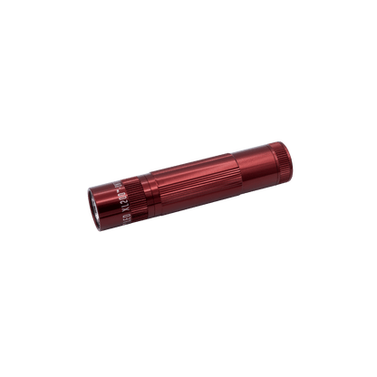 Red Maglite XL200 LED flashlight angled across a black background showcasing limited edition colors