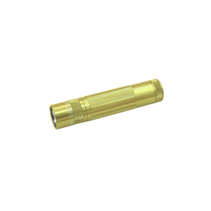 Gold Maglite XL50 LED flashlight diagonally across the lower right