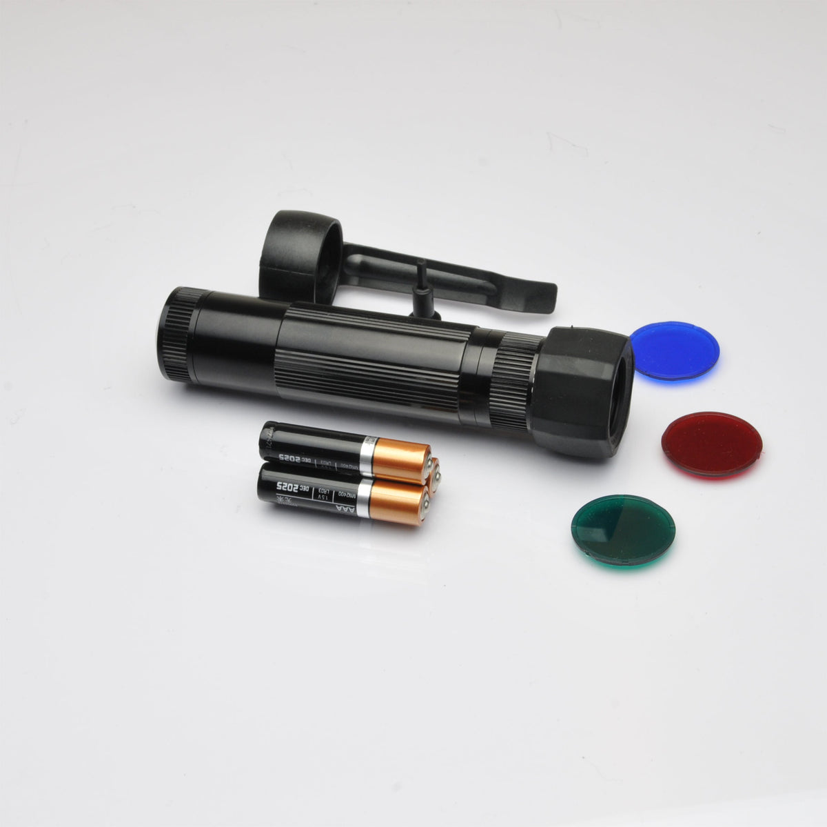 B2B XL50 LED tactical pack components with three batteries and red green and blue caps on a white background.