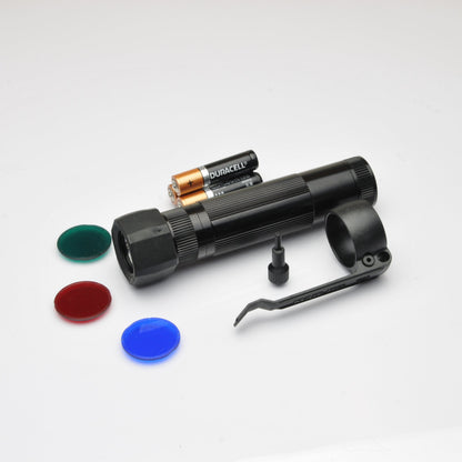 Duracell batteries and a large black XL50 flashlight with mounting bracket and red and blue lens caps in the foreground