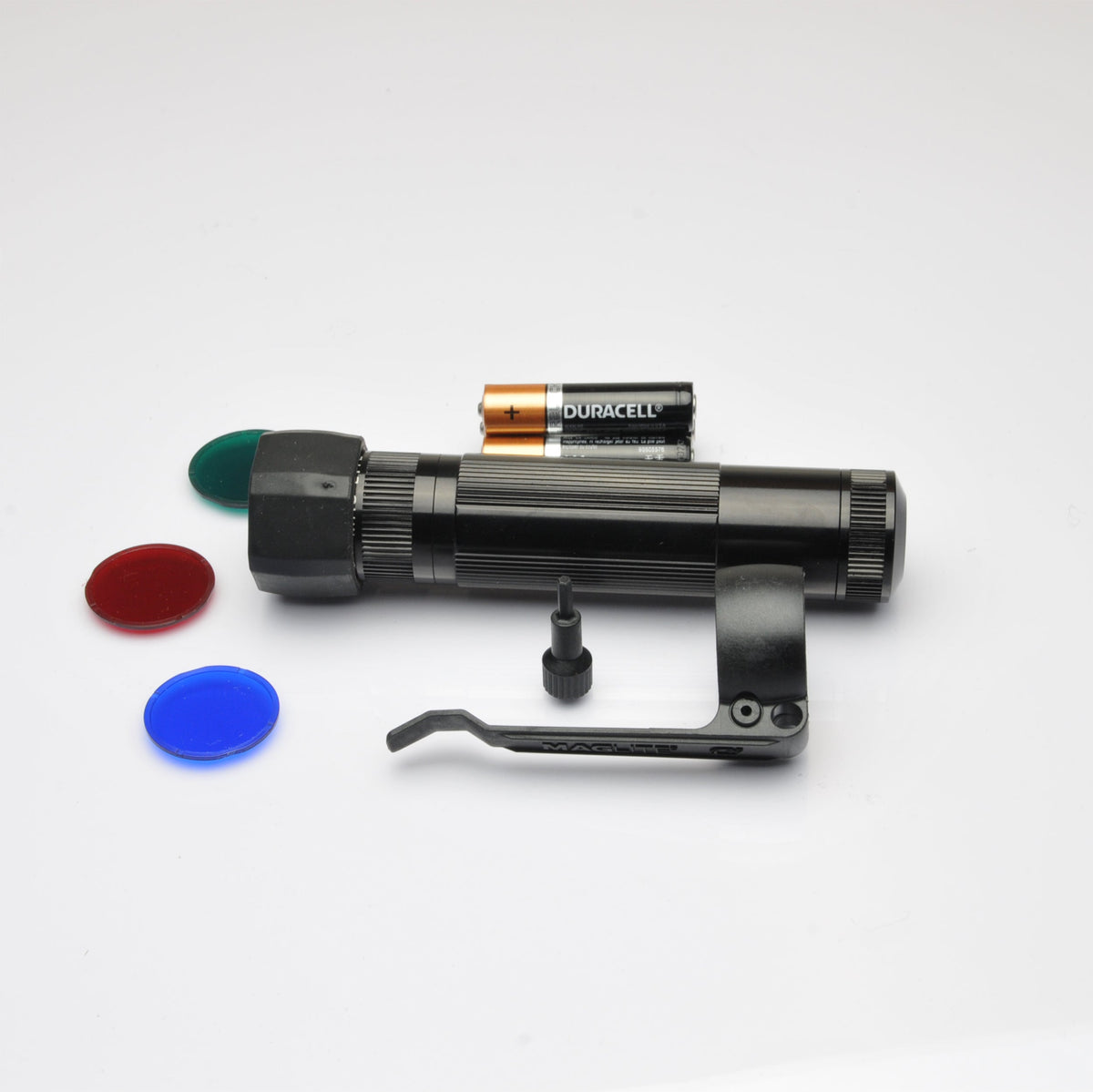 Duracell batteries with the Maglite XL50 flashlight partially visible on a white background