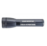 Gray ML25LT two-cell C flashlight with Liam Donovan Field Supervisor engraved on the barrel