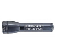 Gray ML25LT LED two cell C flashlight with custom engraving showing J&J Millwork LLC 586-725-5008.