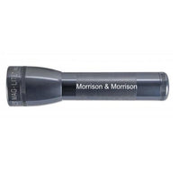 Gray ML25LT LED 2-Cell C flashlight with Morrison & Morrison branding on textured grip