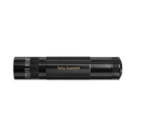Angled view of black XL50 LED 3-Cell AAA flashlight with Terry Guerrant engraving along the body