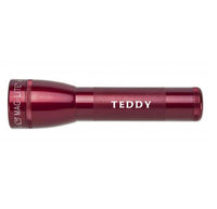 Red ML25LT LED 2-Cell C flashlight engraved TEDDY on the textured grip.