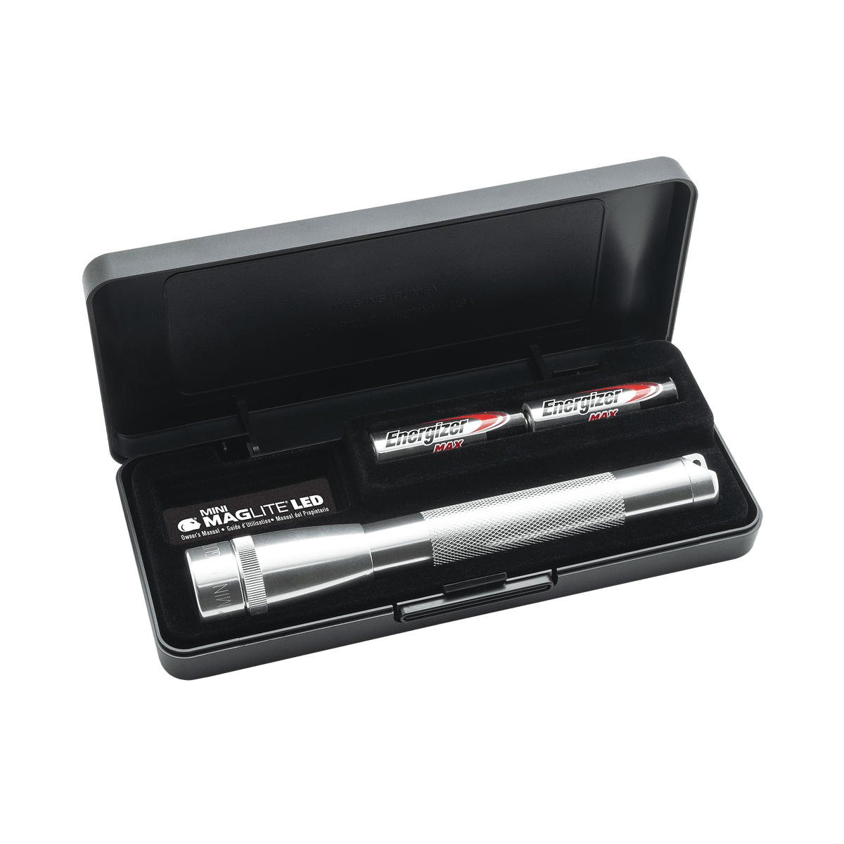 Mini Maglite LED 2AA flashlight with knurled grip and Energizer Max AA batteries nearby in a display case