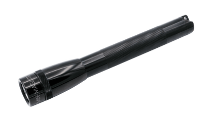 Close up of a black Maglite LED flashlight with a knurled grip
