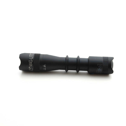Side view of black MAG-TAC flashlight showing branding and ridged grip