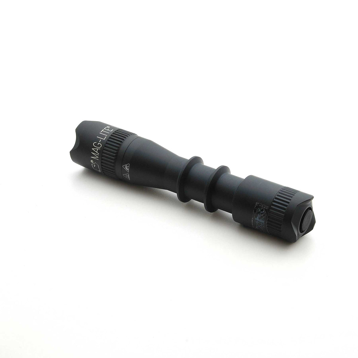 Black MAG-TAC 2 TM flashlight with crown bezel and knurled grip.