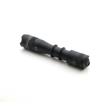 Black MAG-TAC 2 TM flashlight with crown bezel and knurled grip.