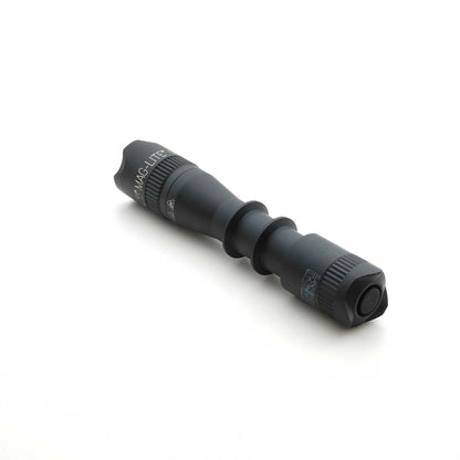 End view of black MAG-TAC 2 TM flashlight showing crown bezel and tail cap.