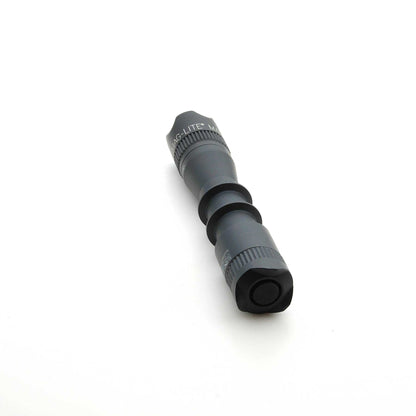Angled view of MAG-TAC 2 TM black crown bezel with knurled ring on a flashlight