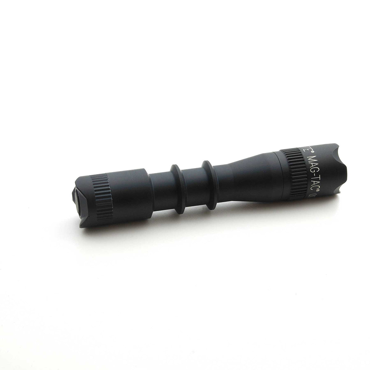 Side view of MAG-TAC 2 TM Black Crown Bezel magnifier showing knurled rings and MAG-TAC labeling