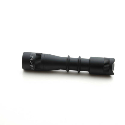 MAG-TAC 2 TL black flashlight with plain bezel shown lying on its side.