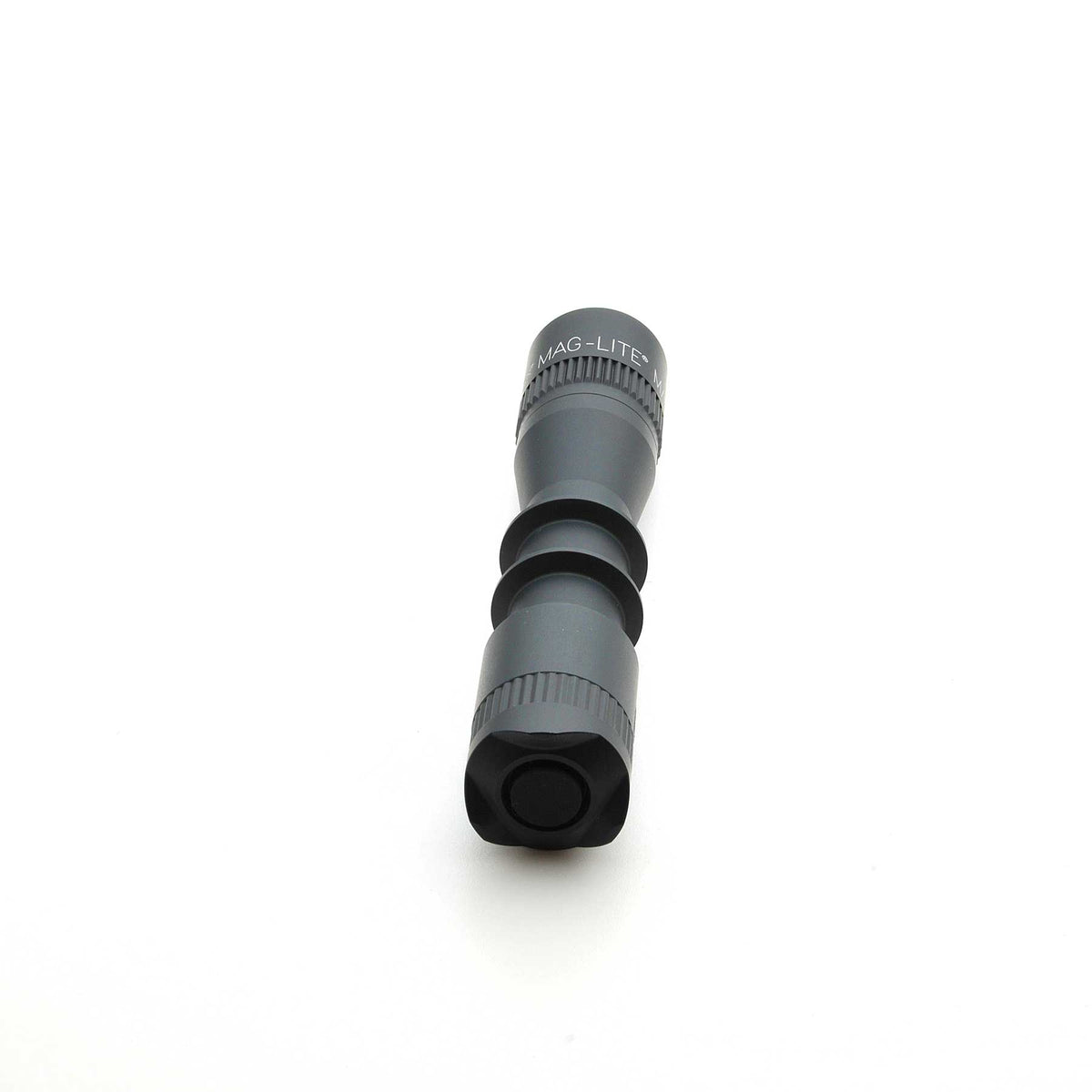 Close up of MAG-LITE MAG-TAC 2 TL Black Plain Bezel flashlight head with knurled ring