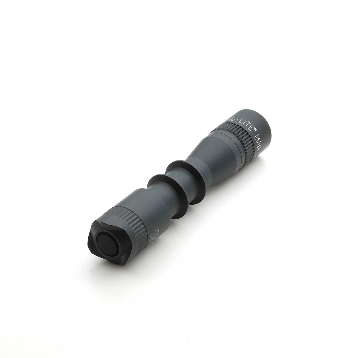 Lower portion of MAG-LITE MAG-TAC 2 TL Black Plain Bezel flashlight with stacked cylindrical segments