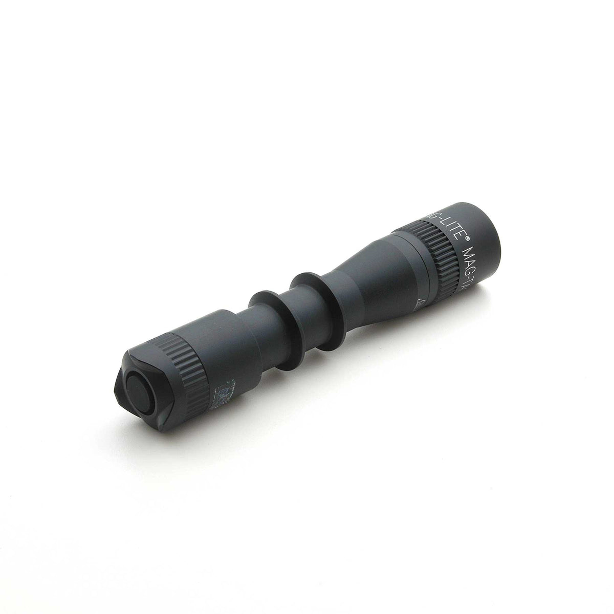 Black MAG-LITE MAG-TAC 2 TL flashlight with plain bezel, angled across a white background showing the textured grip.