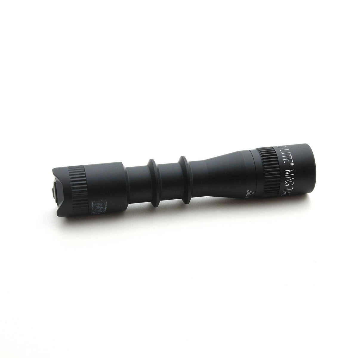 Side view of the MAG-LITE MAG-TAC 2 TL black flashlight with plain bezel, highlighting branding along the body.
