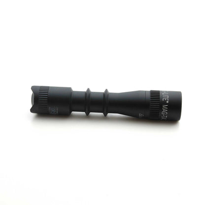 Partial view of MAG-TAC 2 TL black plain bezel flashlight on white background showing the textured midsection.