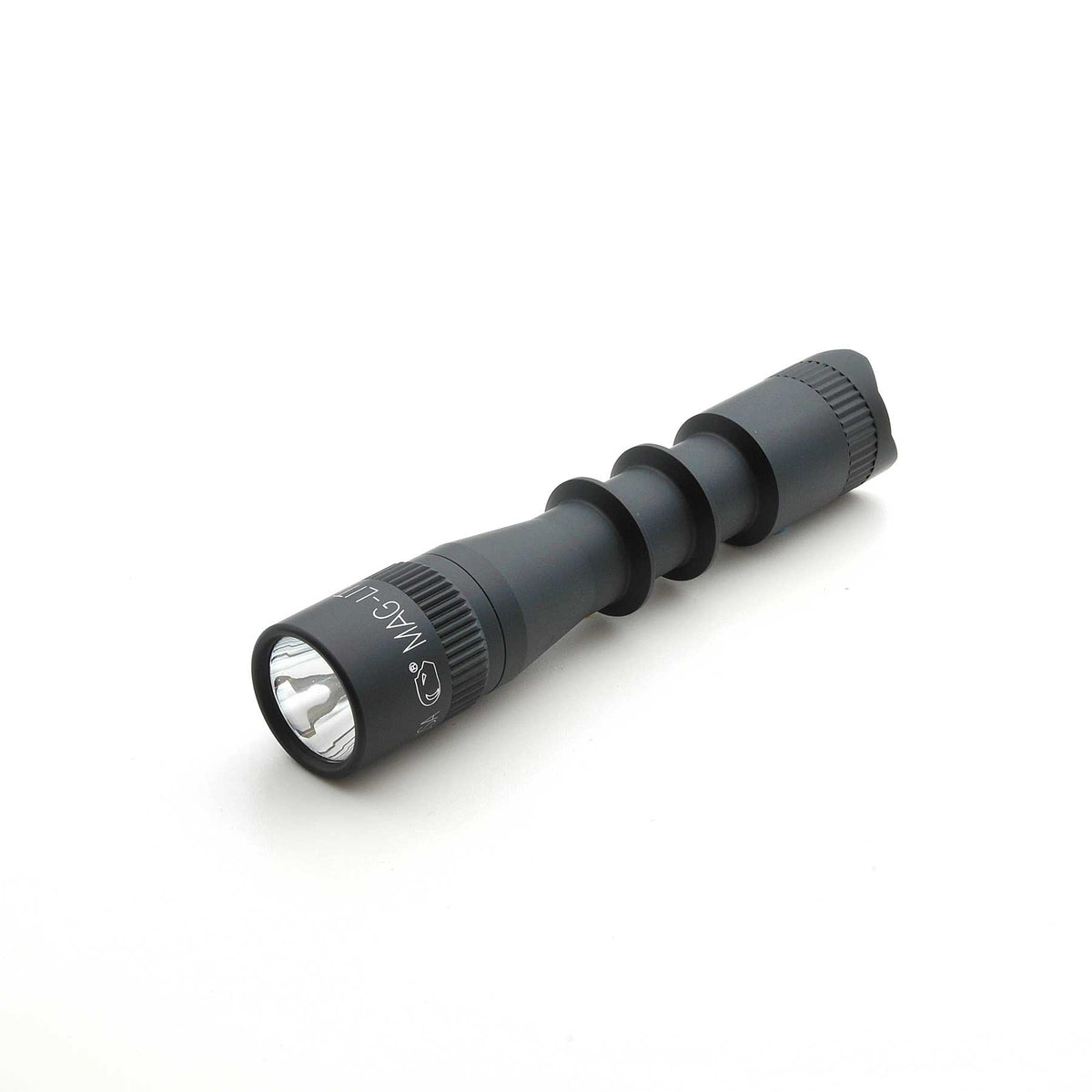 MAG-TAC 2 TL Black Plain Bezel flashlight with prominent lens and textured body
