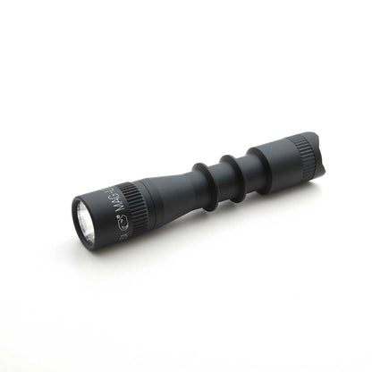 Side view of MAG-TAC 2 TL Black Plain Bezel flashlight showing knurled grip and markings