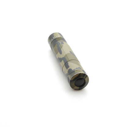 Maglite XL50 flashlight in Mossy Oak Original Bottomland camouflage angled diagonally with knurled grip.