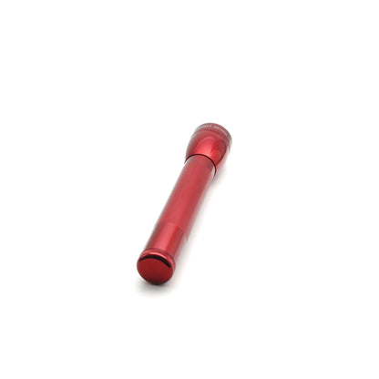 Red ML25LT LED 3-Cell C flashlight shown at a low angle with knurled handle and tail cap