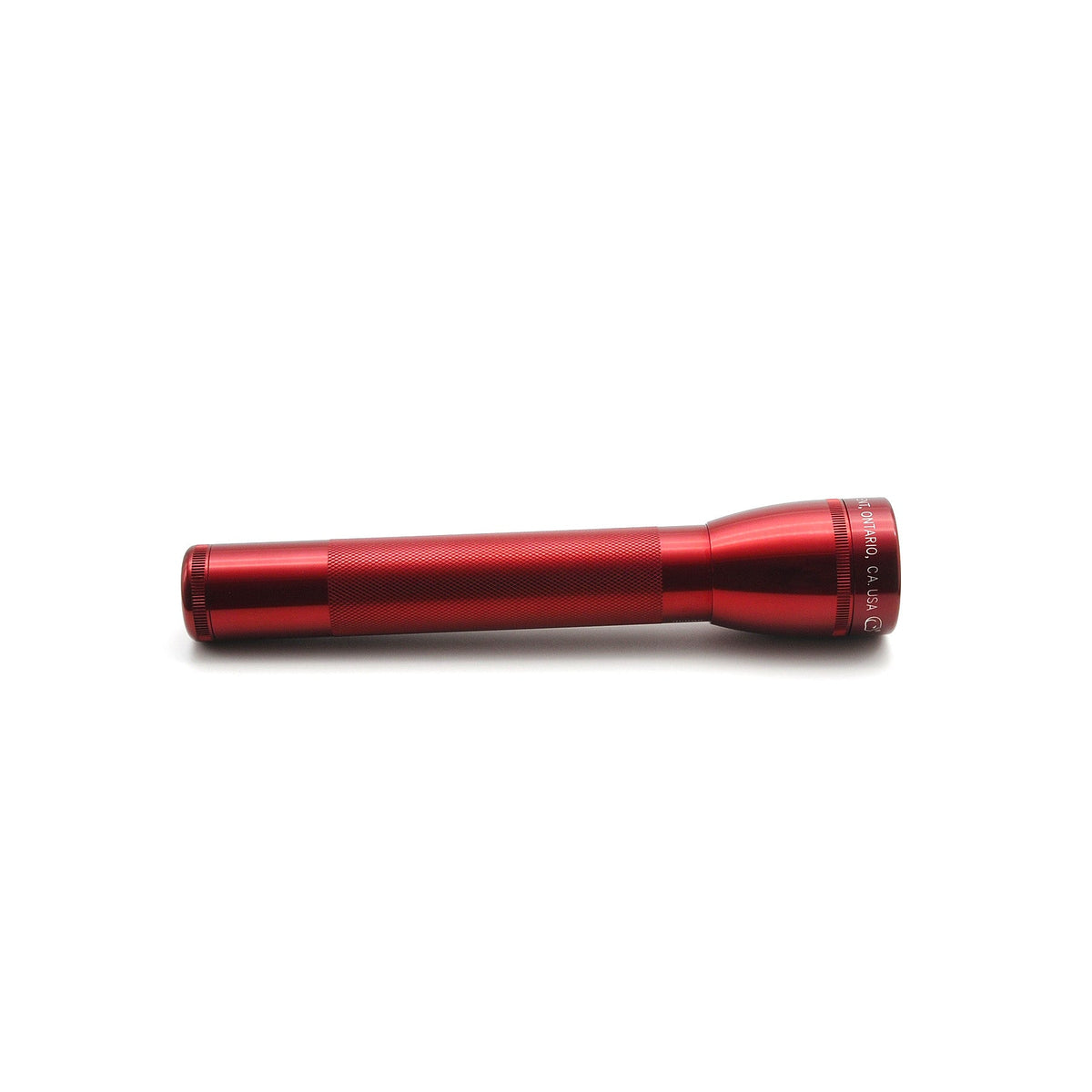 Red aluminum ML25LT LED 3-Cell C flashlight lying horizontally on a white background with knurled grip