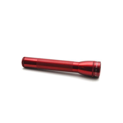 Red ML25LT LED 3-Cell C flashlight photographed from the side showing knurled grip on a white background