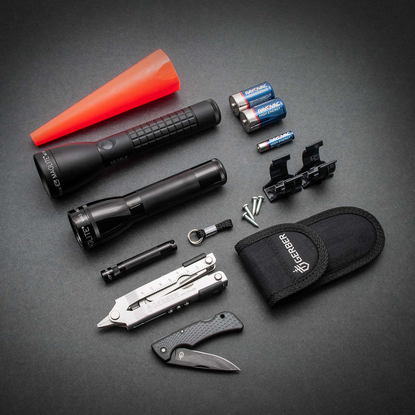 Includes one black Solitaire LED Flashlight, one premium alkaline battery (AAA), and one key-lead (keys not included): one black matte ML50LX LED Flashlight 2C, and Gerber Multi-Tool with carrying case and a US1. It also consists of an ML25LT LED 2C, two premium alkaline batteries (C), C-Cell Mounting Brackets, and a red safety wand for the ML25LT.