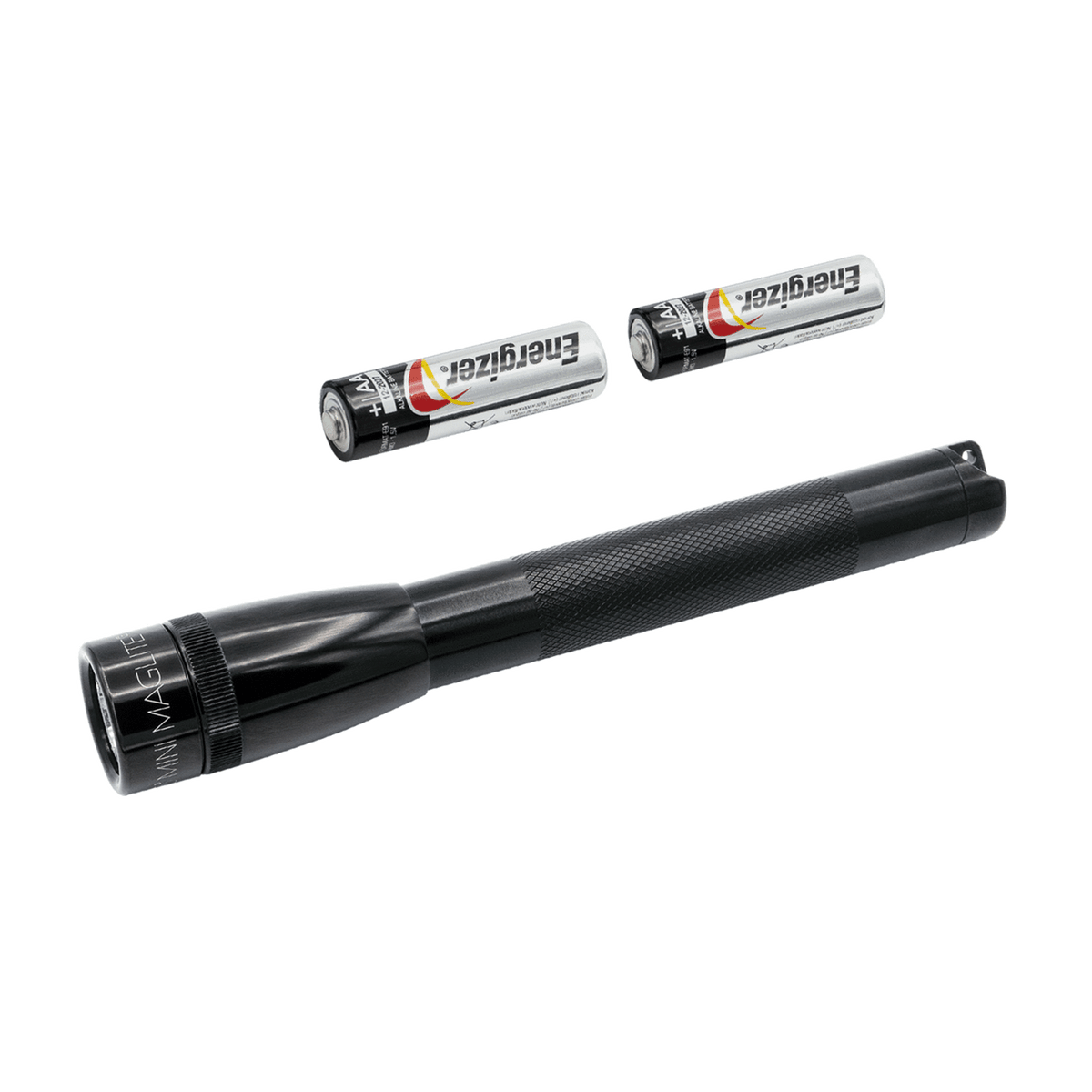 Close up of a Mini Maglite LED 2AA flashlight with two Energizer batteries nearby