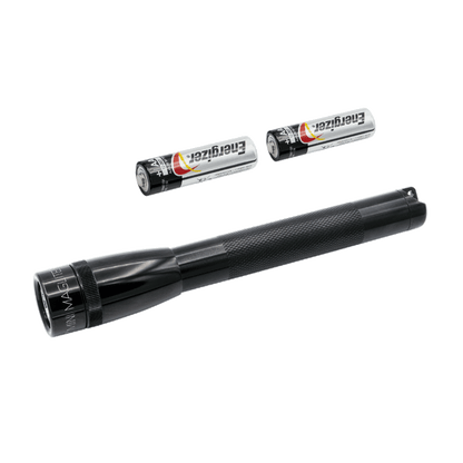 Close up of a Mini Maglite LED 2AA flashlight with two Energizer batteries nearby