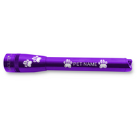 Purple Maglite Pro LED flashlight with paw print engraving and PET NAME along the body