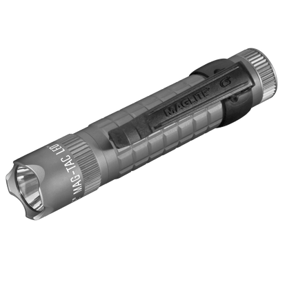 Angled view of MAG-TAC CR123 LED flashlight body highlighting the textured grip and crown bezel