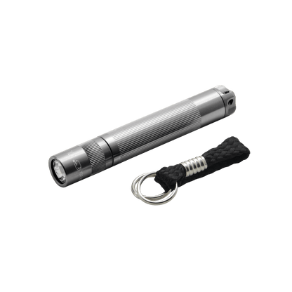 Silver Solitaire LED key chain flashlight with knurled body beside a braided cord and key ring.
