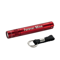 Red Maglite Solitaire LED Forever Mine key chain flashlight with a black braided lanyard