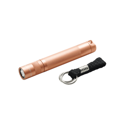 Copper colored Solitaire LED keychain flashlight with knurled body and braided lanyard.
