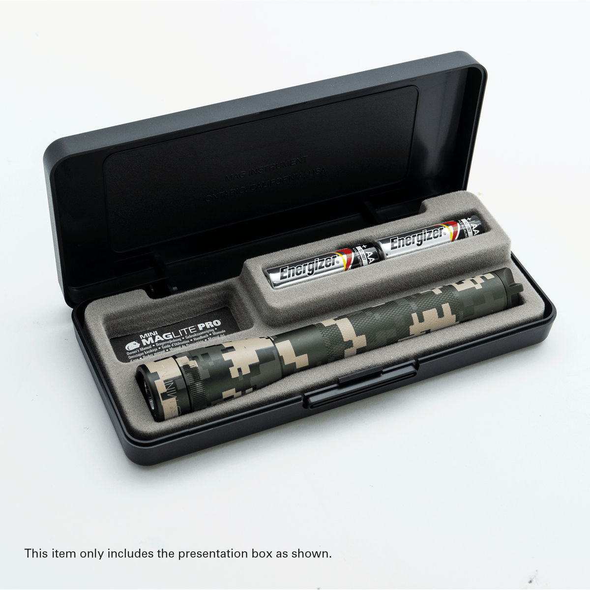 Camouflage Maglite Pro flashlight inside a presentation box with foam insert and Energizer batteries.