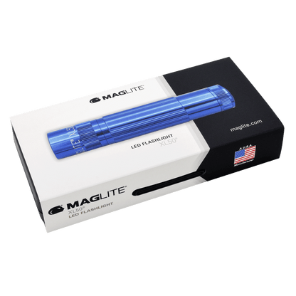 Blue Maglite XL50 LED flashlight resting on its white and black Maglite packaging box with logo