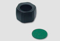 Black hex nut shaped lens adapter with a green filter disc for the NVG MMAA accessory kit